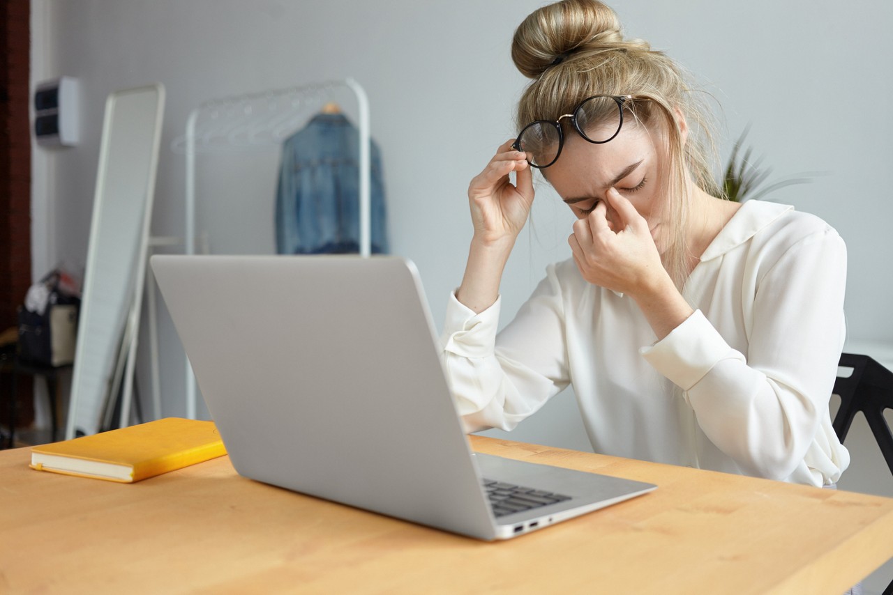 woman with eczema working from home